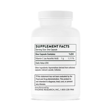 White plastic supplement bottle with white cap containing Vitamin C capsules and label showing supplement facts.