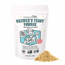 White pouch of Legendairy Milk brewer's yeast powder with tan powder displayed beside it.