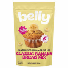 A pale yellow pouch of Belly gluten-free banana bread mix shows a banana muffin topped with a banana slice and pink labels.