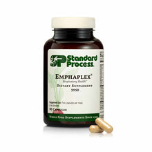 Dark amber glass bottle of Standard Process Emphaplex dietary supplement with white cap and label, with two tan capsules disp