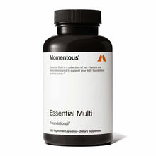 Black bottle of Momentous Essential Multi dietary supplement with white label and black screw cap containing 120 vegetarian c