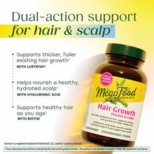 Megafood Hair Growth supplement bottle with green cap containing 30 vegetarian capsules, displayed against yellow gradient ba