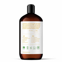 Dark amber glass bottle of hand soap with black pump top and white label listing ingredients and certifications.