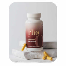Rho Nutrition Liposomal Berberine bottle with white cap and red label, displayed with golden capsules on marble surface.