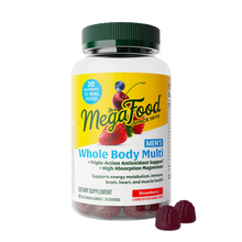 Megafood Men's Whole Body Multi bottle with green cap and strawberry-flavored gummies displayed in front.