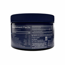 Dark glass jar with navy blue ridged lid containing magnesium powder with supplement facts label visible.