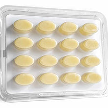 Clear plastic tray containing 16 pale yellow oval tablets arranged in four rows of four.