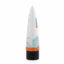 White tube with orange and teal graphics and black base containing Redmond Clay Facial Mud with Silver.