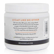 White jar with white screw-top lid containing bentonite clay powder, labeled with orange and black text.