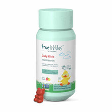True Littles Daily Kids Multivitamin bottle with mint-green cap and label, displayed with red gummy vitamins.