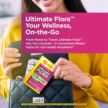 Woman in yellow shirt holding Ultimate Flora probiotic supplement blister pack in handbag with product packaging visible.