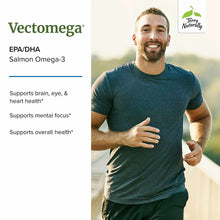 Man jogging outdoors wearing teal t-shirt with Vectomega product information and Terry Naturally logo displayed on left side.