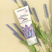 Derma E Vitamin E Shea Body Lotion tube with lavender and neroli branding, surrounded by fresh lavender sprigs on beige backg
