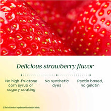 Close-up of red strawberry with yellow seeds, representing strawberry-flavored gummy supplement.