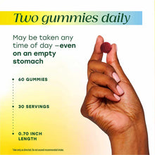 Hand holding red and pink probiotic and prebiotic gummies, 60 count bottle with dosage and usage information.