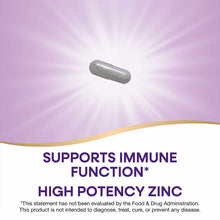 Gray oval capsule supplement displayed against a pink background with radiating light effect.