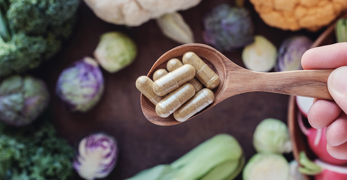 ashwagandha supplement surrounded by vegetables