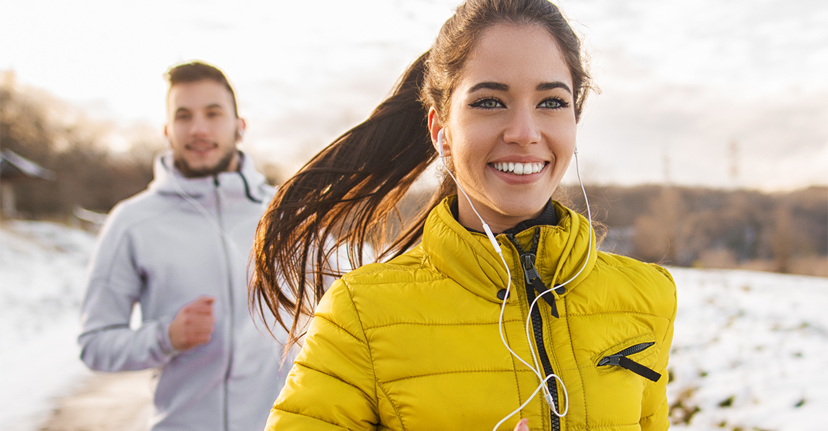 A man and women running in cold weather