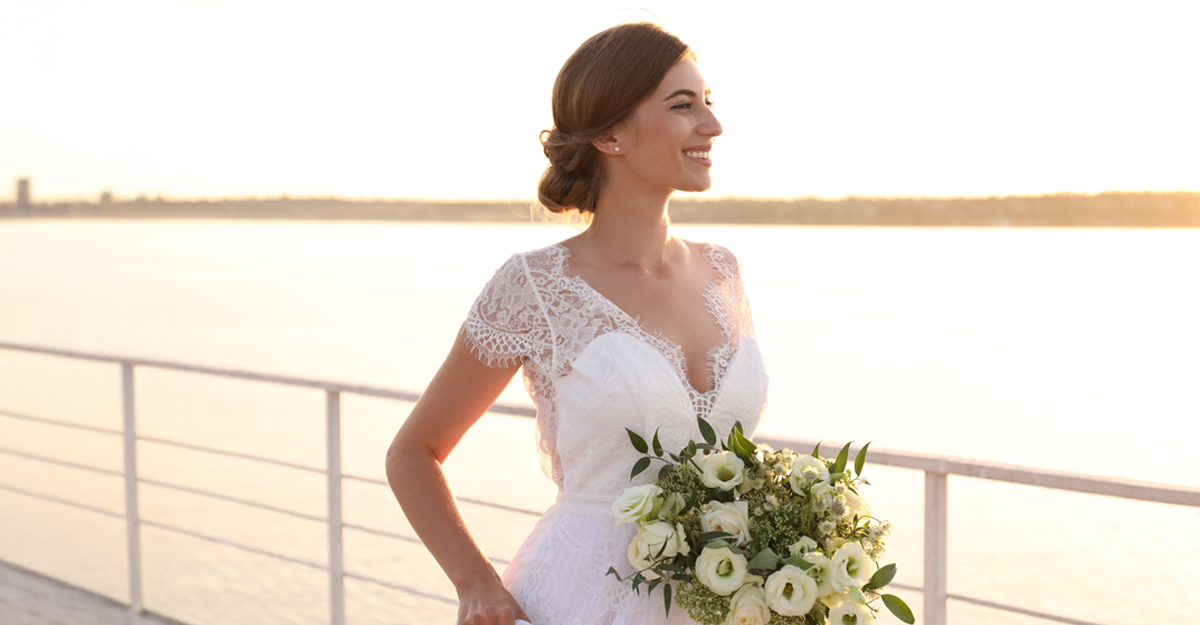 A bride looking out on a body of water