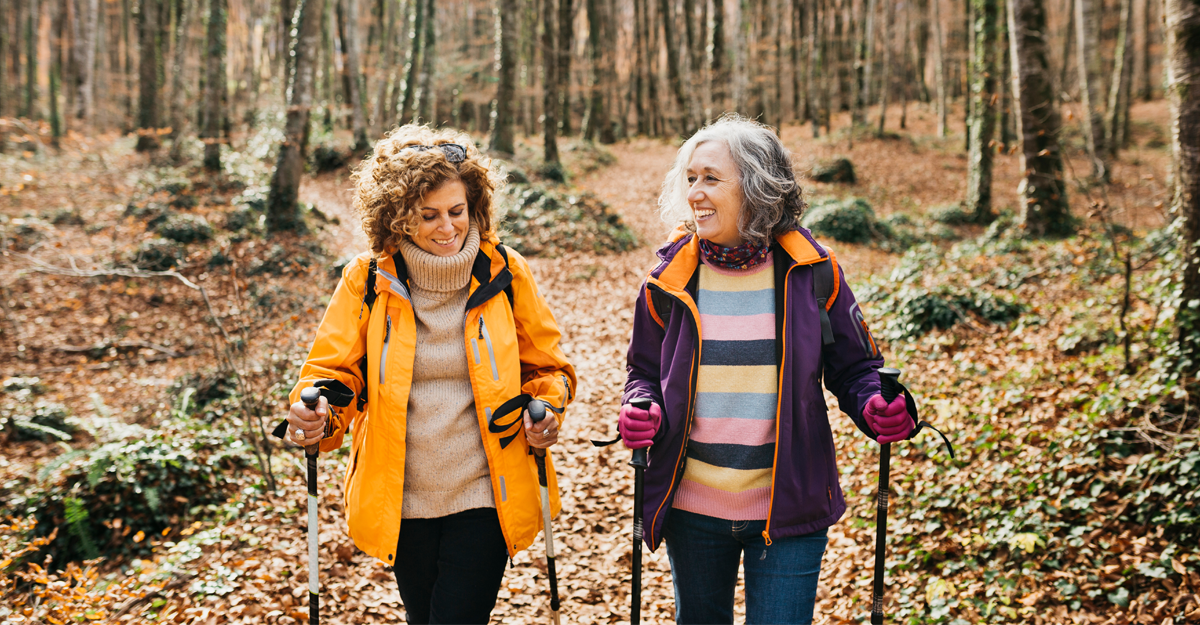 A couple of women hiking in the fall outdoors