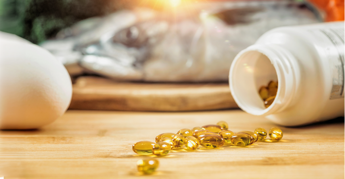A bottle spilled with supplements on a wooden table