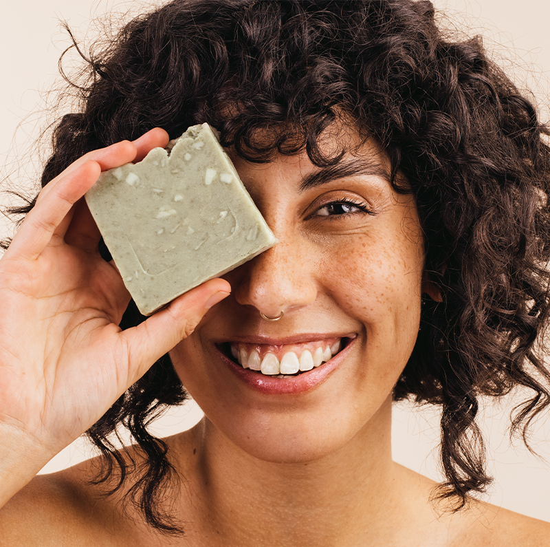 Woman with bar of soap