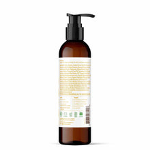 Dark amber glass pump bottle with white label containing lotion product information and ingredient list.