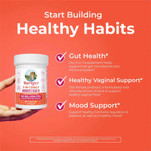 White supplement bottle labeled "MaryRuth's 3-in-1 Daily Women's Health" with 50 billion CFU held in hands against orange bac