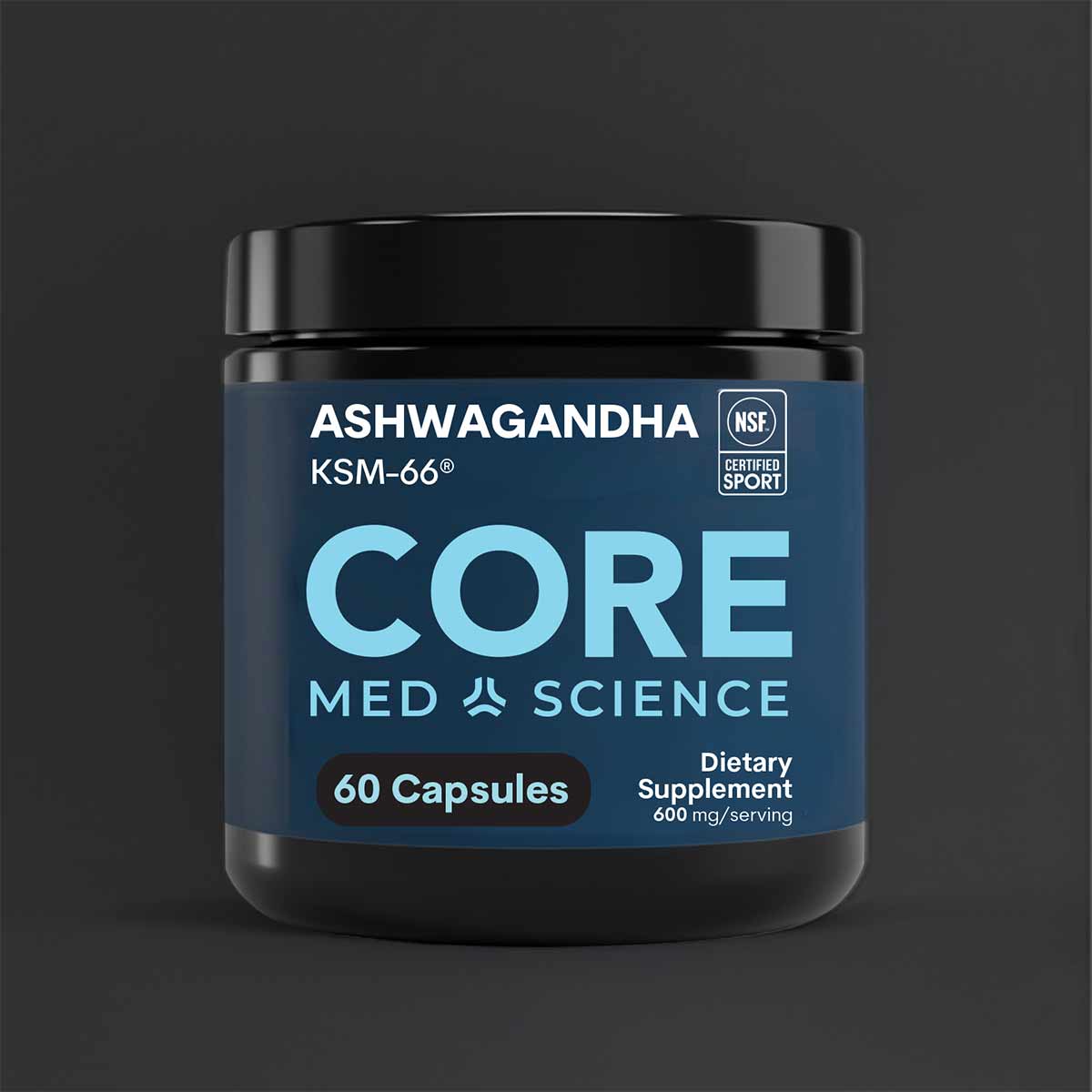 Dark blue and black cylindrical bottle of Core Med Science Ashwagandha capsules with white text and NSF Certified Sport badge