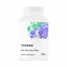 White bottle with white cap labeled "THORNE Basic Nutrients 2/Day" dietary supplement, 120 capsules.