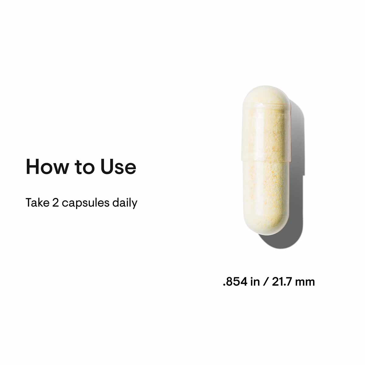Cream and yellow capsule measuring 21.7mm with usage instructions stating take 2 capsules daily.
