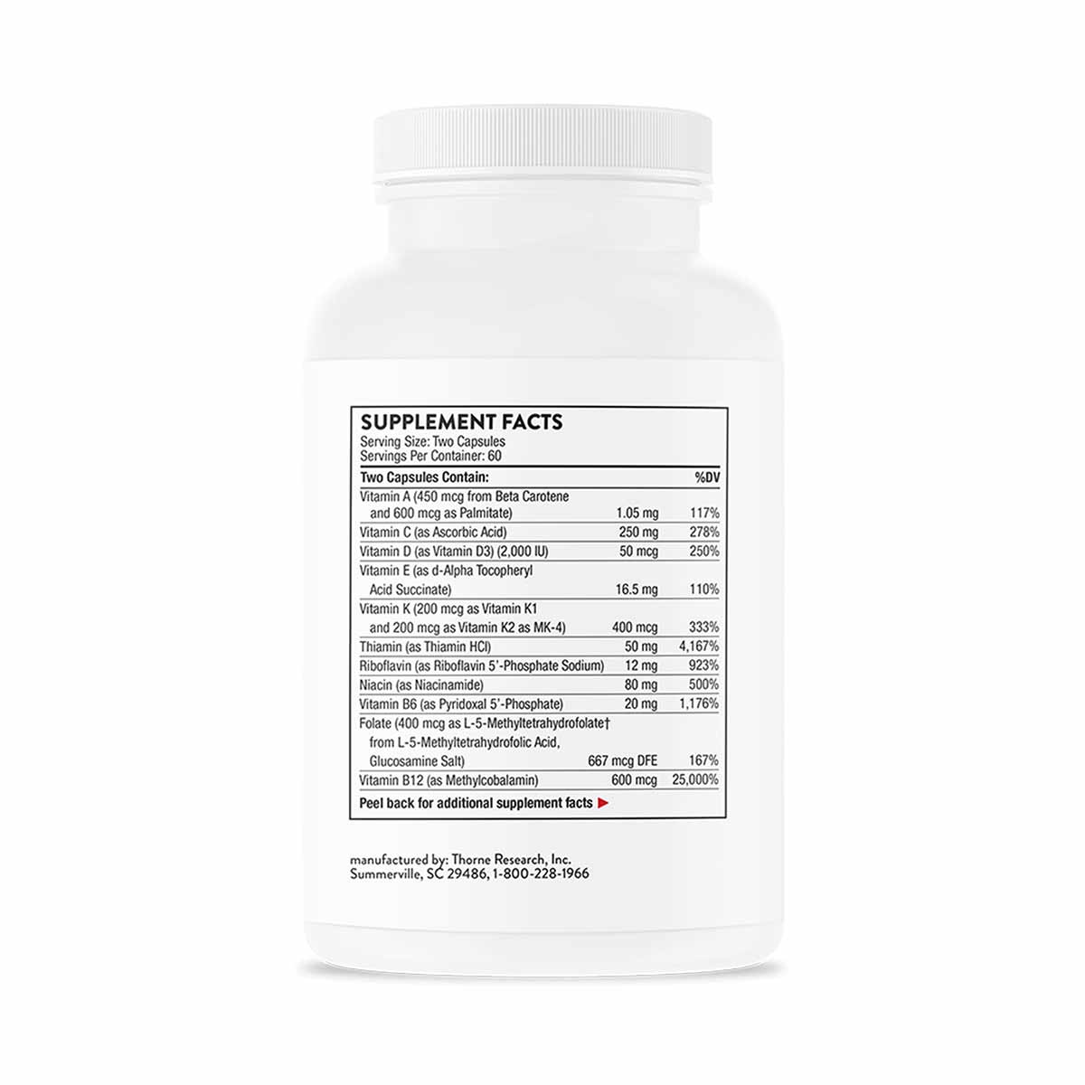 White plastic bottle of Basic Nutrients 2/Day capsules by Thorne Research with supplement facts label visible.