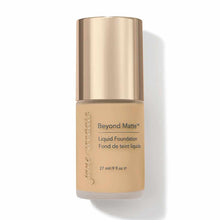 Beyond Matte Liquid Foundation bottle with champagne-colored cap and beige foundation visible through clear lower section.