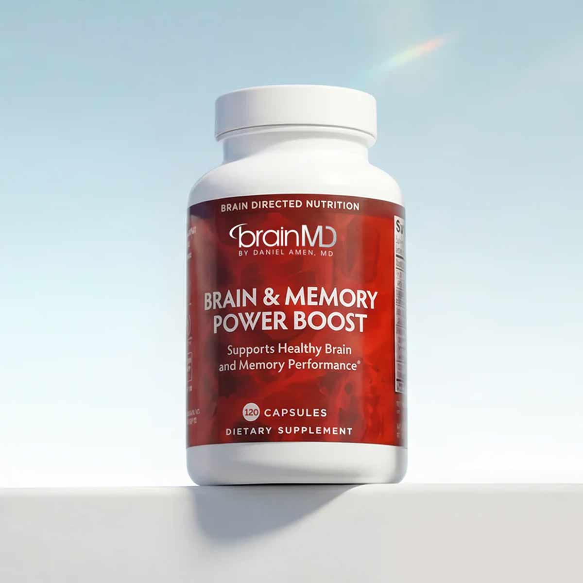 BrainMD Brain & Memory Power Boost bottle containing 120 capsules with white cap and burgundy label.