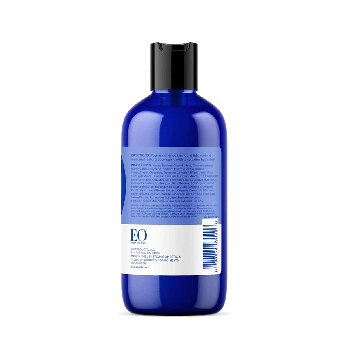 Blue plastic bottle with black cap containing EO Products bubble bath, back label visible.