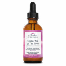 Amber glass bottle with black dropper cap and pink label reading "Heritage Store Castor Oil & Tea Tree Clarifying Scalp Treat
