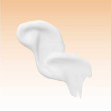 White creamy lotion swirl on beige background.