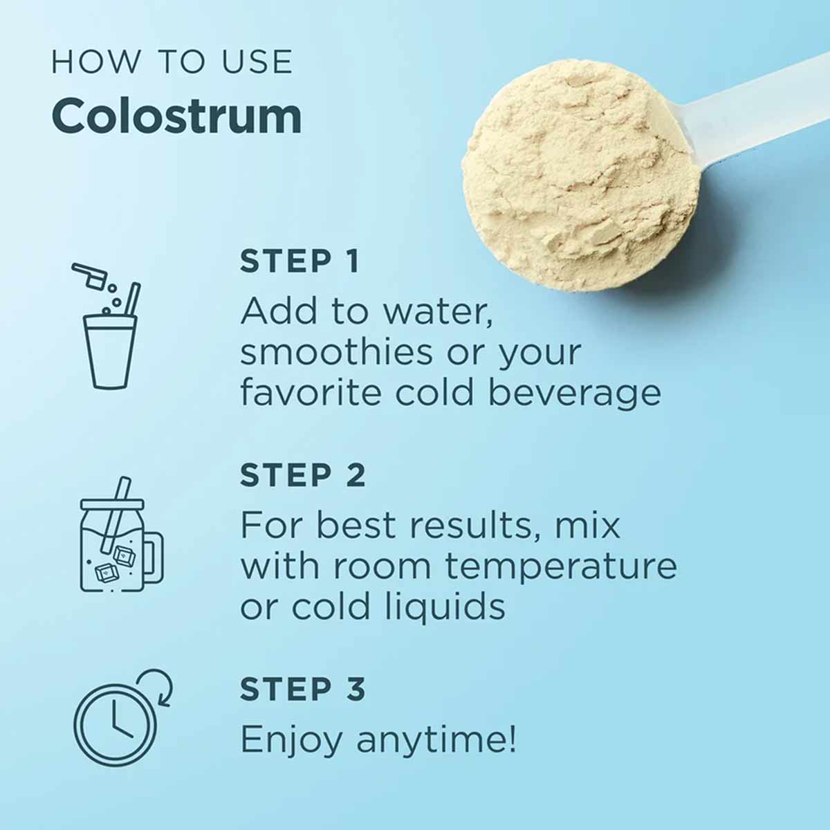 Beige colostrum powder on white scoop with usage instructions on light blue background.