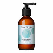 Brown glass bottle with black pump dispenser labeled "Mad Hippie Cream Cleanser" and watercolor design elements.
