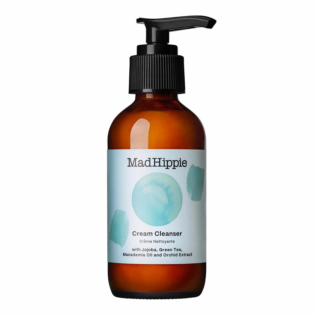 Brown glass bottle with black pump dispenser labeled "Mad Hippie Cream Cleanser" and watercolor design elements.
