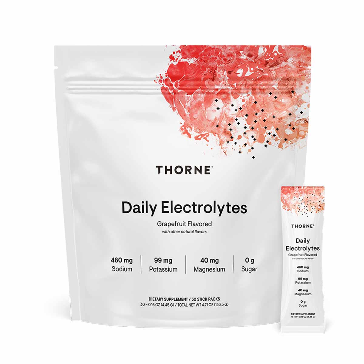 White pouch of Thorne Daily Electrolytes grapefruit flavored powder with 30 stick packs and individual packet displayed besid