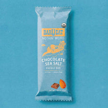 BAR U EAT chocolate sea salt energy bar in white wrapper with blue label and USDA organic seal on turquoise background.