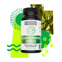 Black bottle with white label reading "Zhou Essential Mineral Complex" dietary supplement, 60 capsules, displayed against gre