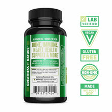 Black bottle of Zhou Nutrition Essential Mineral Complex with green label and certification badges for lab verified, vegan, g