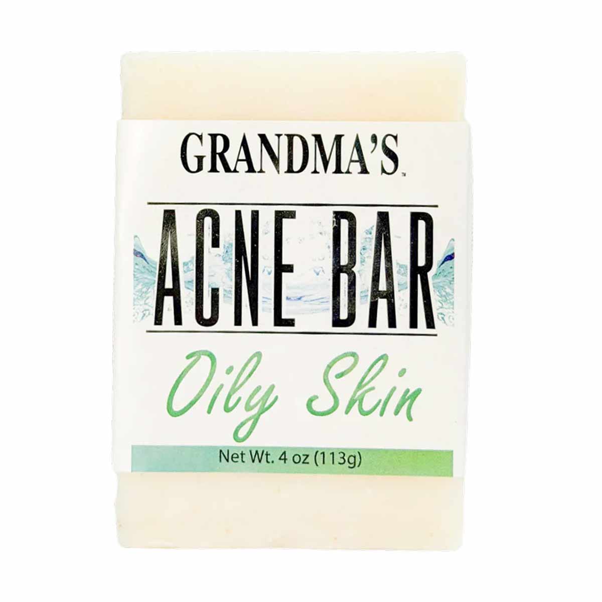 Cream-colored bar soap labeled "Grandma's Acne Bar" for oily skin, 4 oz, with green text and label accents.