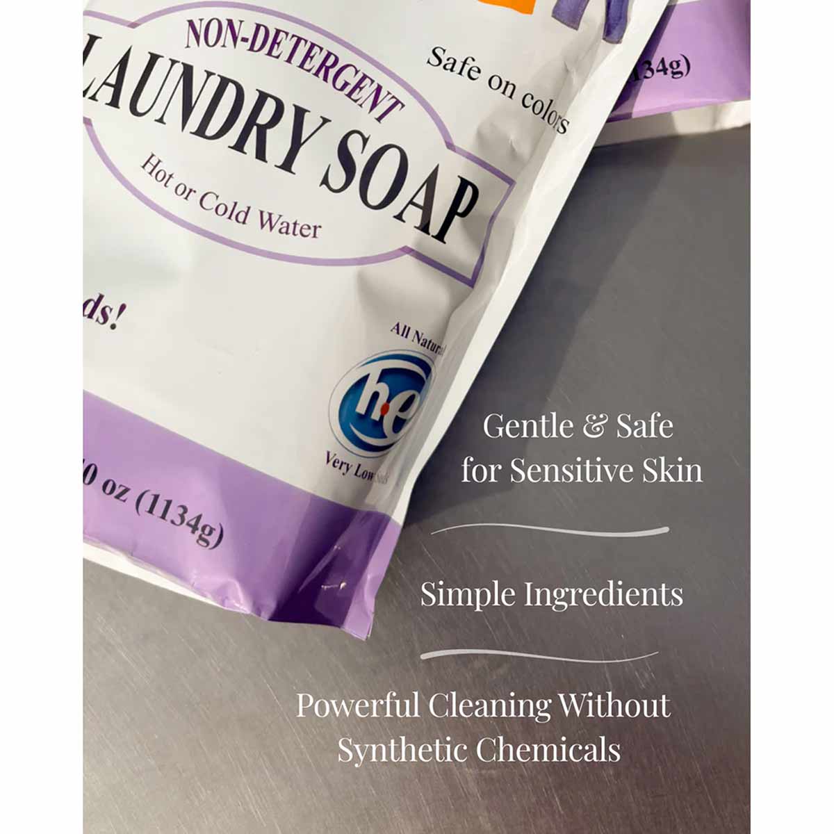 White and purple pouch of Grandmas Non-Detergent Laundry Soap labeled for hot or cold water use.