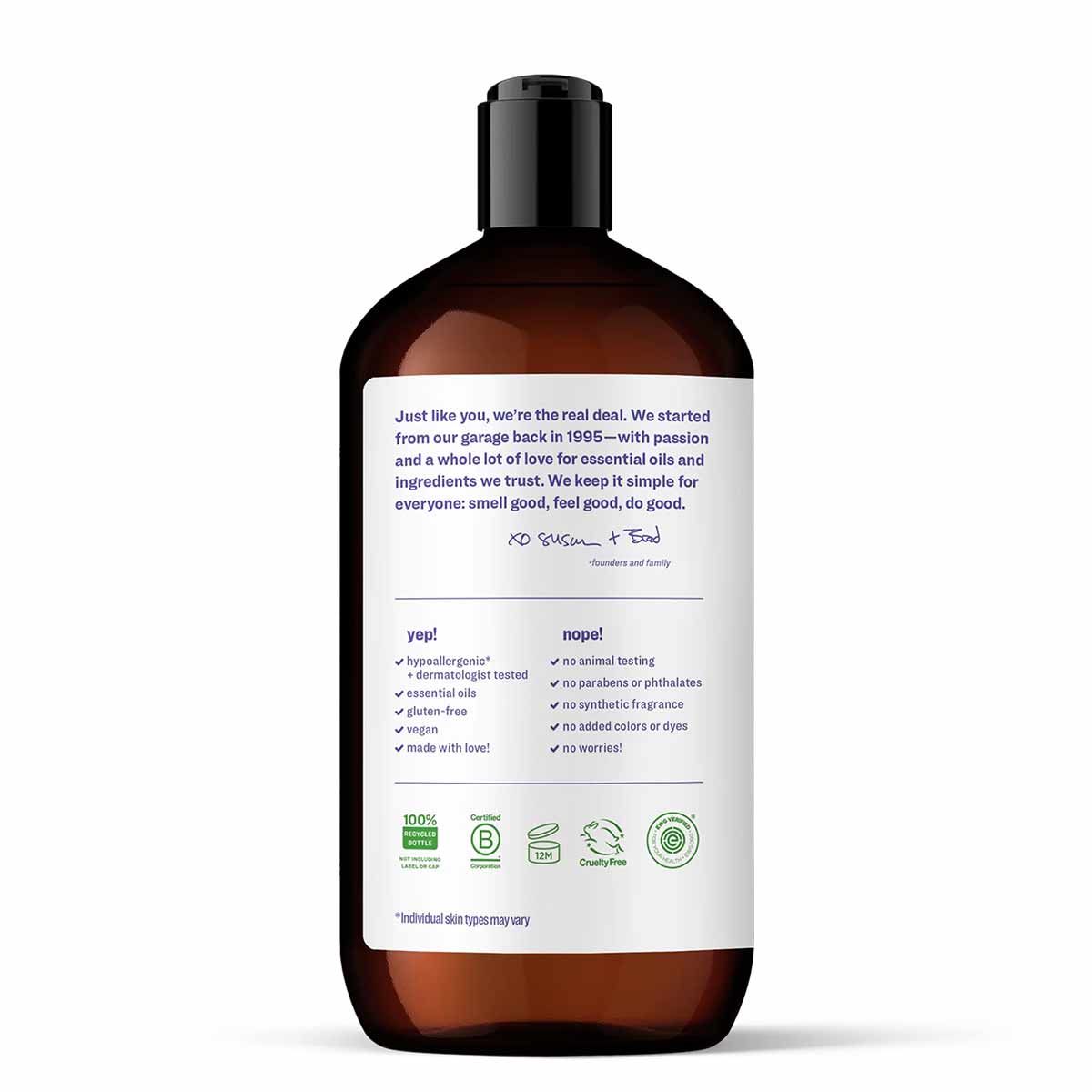 Dark amber glass bottle of hand soap with black pump top and white label detailing product ingredients and certifications.