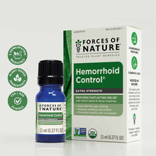 Blue glass bottle with black cap next to cream and green product box labeled "Hemorrhoid Control Extra Strength" by Forces Of
