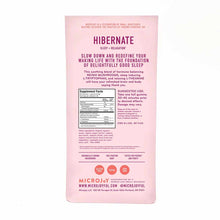 Pink package of Hibernate sleep gummies by MicroJoy with purple text describing ingredients and usage instructions.