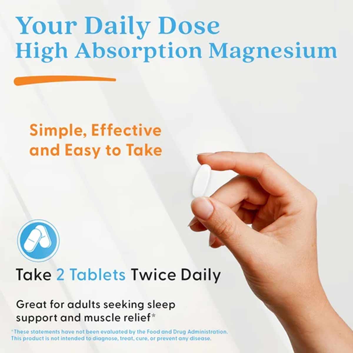 Hand holding a white tablet above product packaging for High Absorption Chelated Magnesium by Doctors Best.